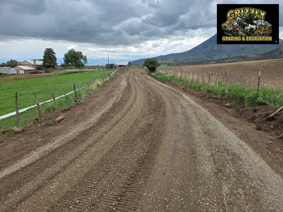 Large-scale grading in the Crawford area. Wide open site, material moved, base course track-walked in &mdash; with that mountain backdrop the whole time. This is the kind of work that makes a property usable. Follow Grizzly Grading. (970) 433-5750