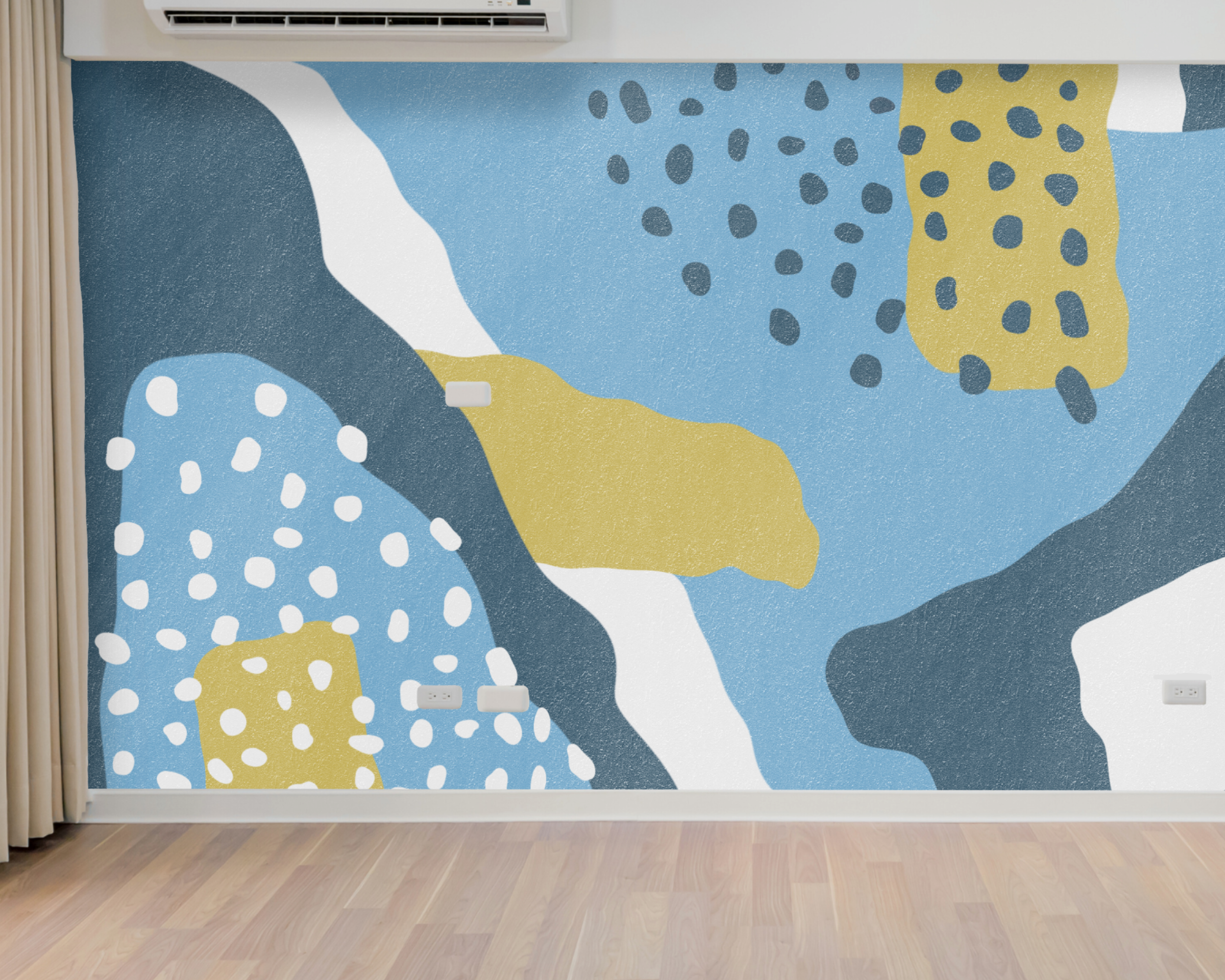 Abstract wall mural with blue, white, gray, and yellow shapes and patterns in a room with wooden floor and beige curtains.