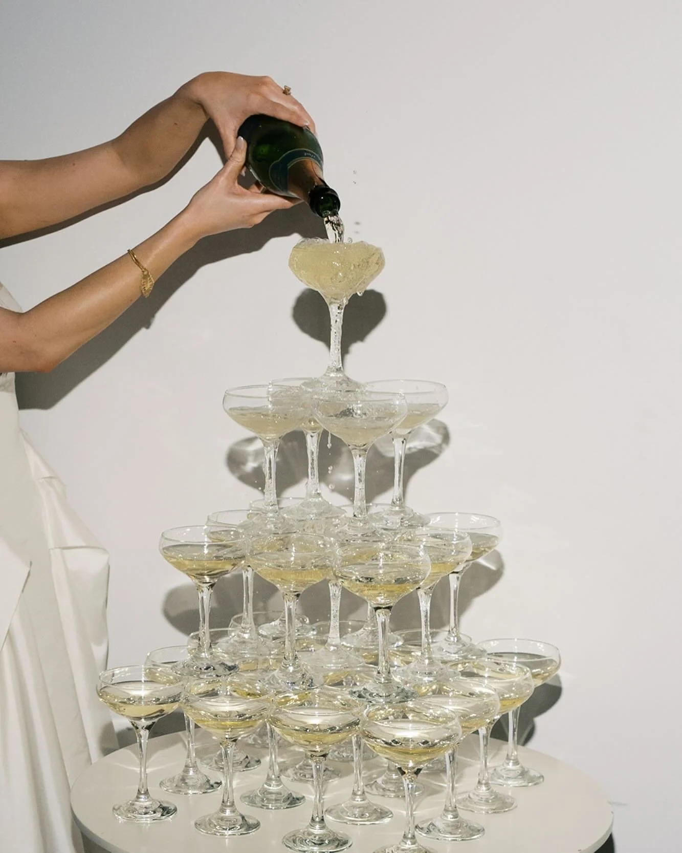 Bride pouring champagne on champagne tour set up by Gourmet Gals Catering.