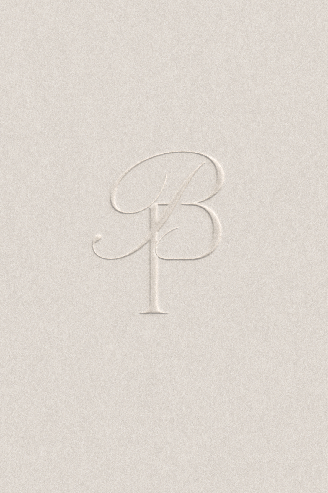 Embossed letters BP couples monogram design on a light beige background. Custom wedding and events collateral design that creates a cohesive and memorable event theme for the day.