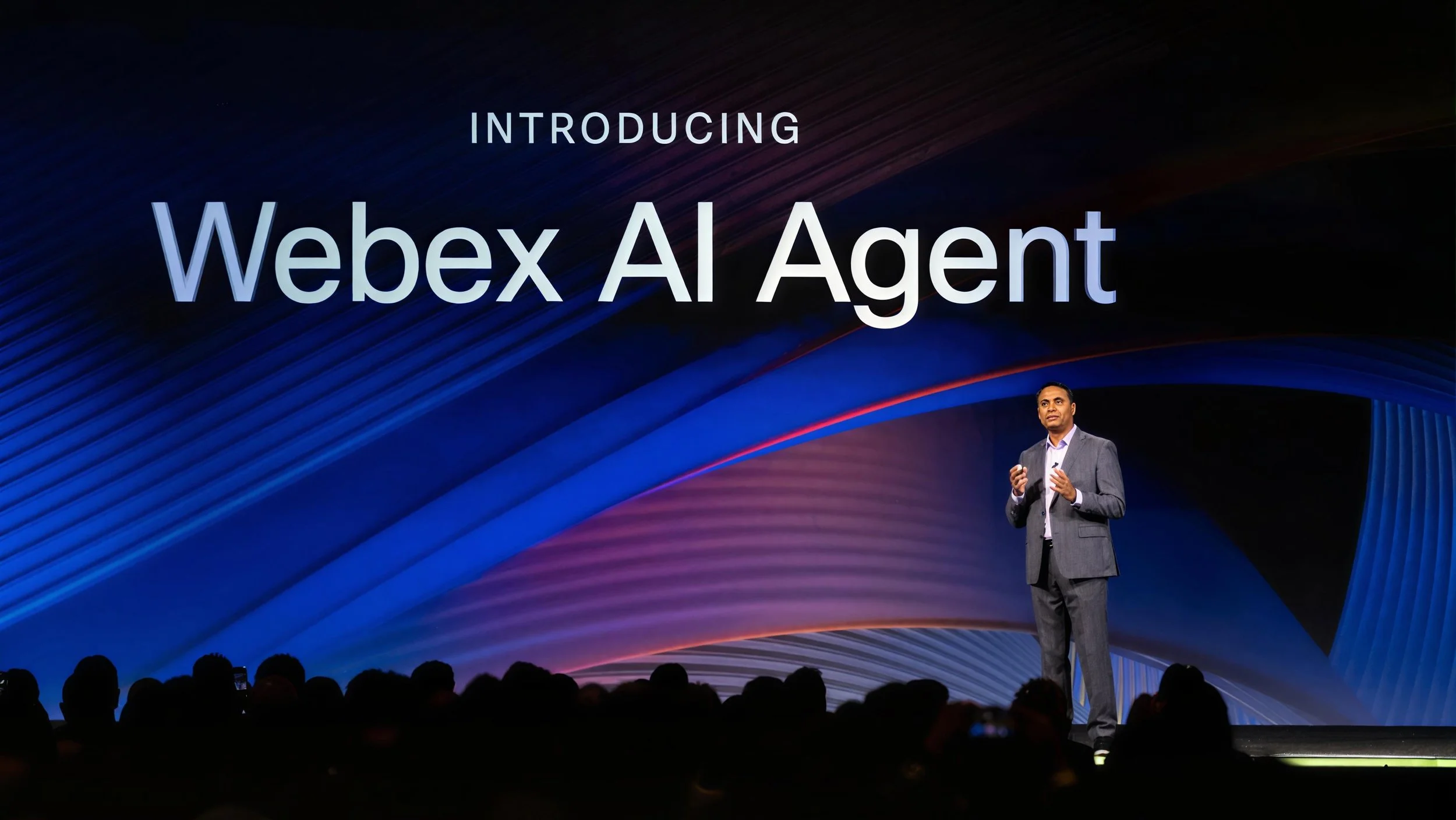 Presenter introducing Webex AI Agent on stage at WebexOne 2024 keynote.