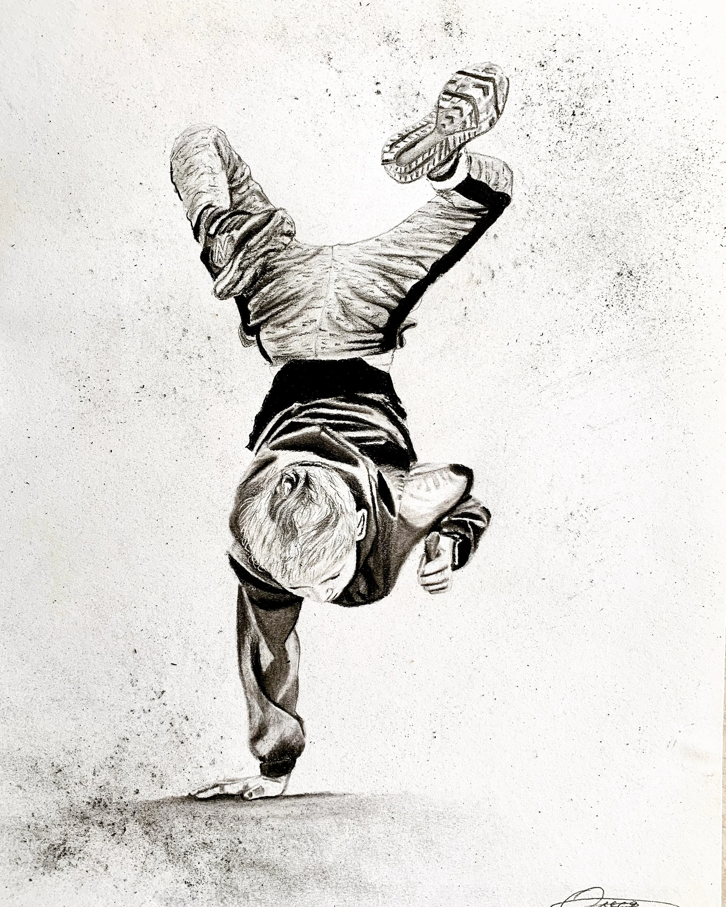 Black and white drawing of a boy performing a breakdance move on one hand, with one leg extended in the air and the other bent. The boy is wearing a hoodie, shorts, and sneakers.