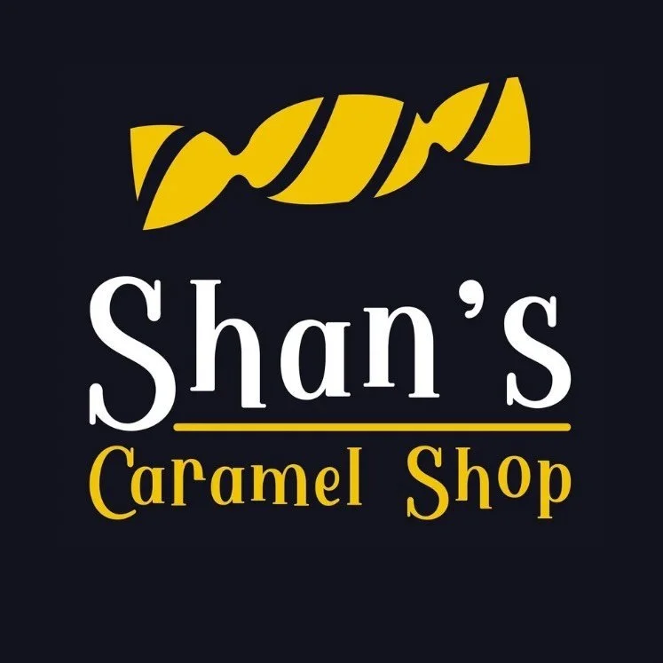 Logo for Shan's Caramel Shop with stylized yellow and black text.