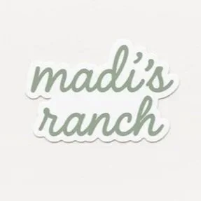 Logo with the text 'madi's ranch' in cursive font