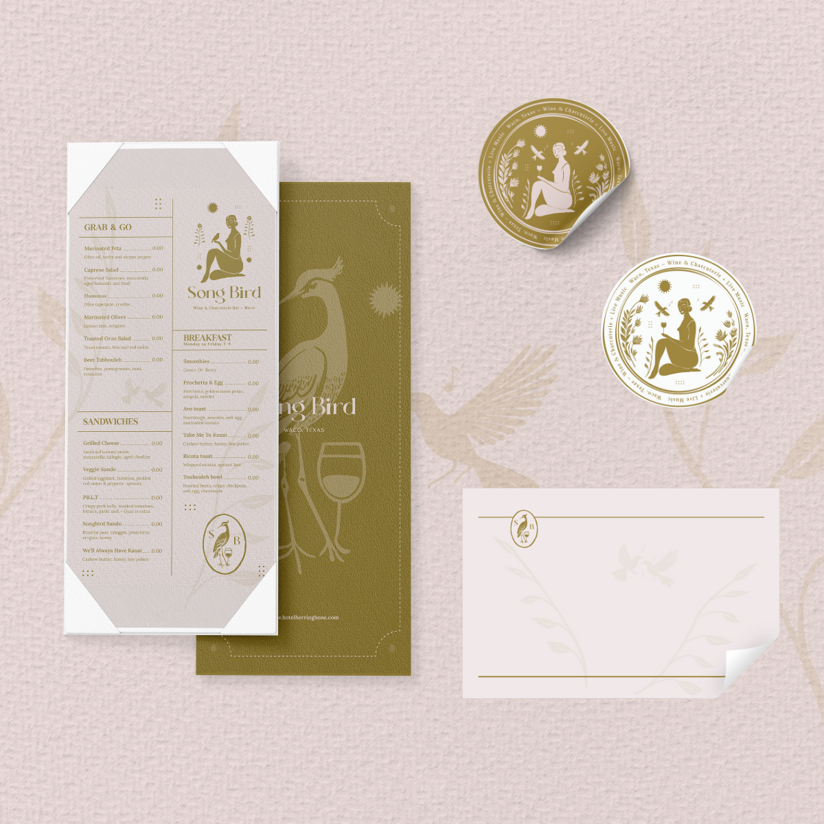 Menu and branding materials for Song Bird, a restaurant in Waco, Texas, featuring a logo with a sitting woman, birds, and foliage, with circular stickers and a letter or notecard