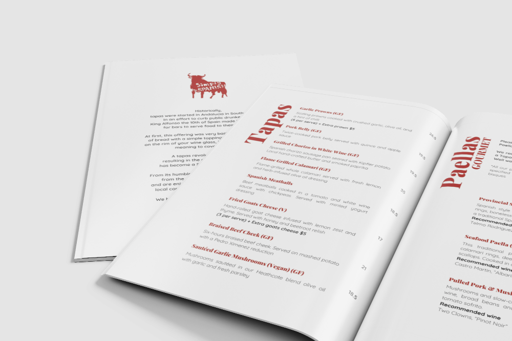 Open restaurant menu with Spanish tapas, paella, and other dishes listed.