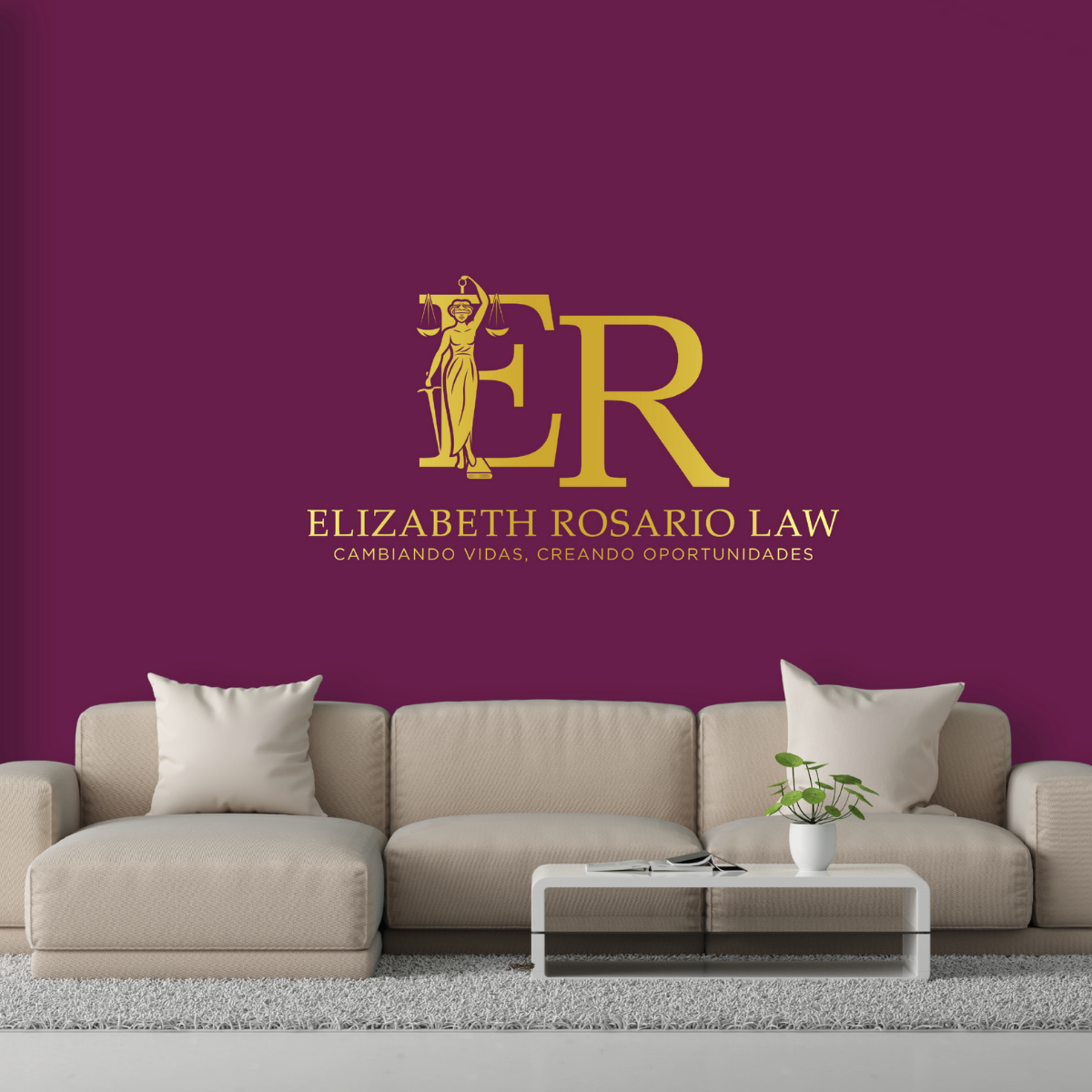 Interior of a living room with a beige sofa, white cushions, a white coffee table with a book and a potted plant, and a deep purple wall featuring a logo for Elizabeth Rosario Law, including a gold lady justice figure and text.