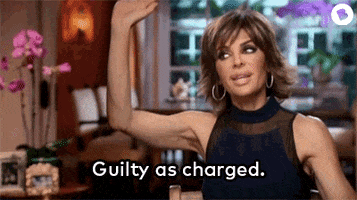 Woman raising her hand during a reality TV conversation