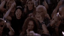 Group of people cheering at a celebration