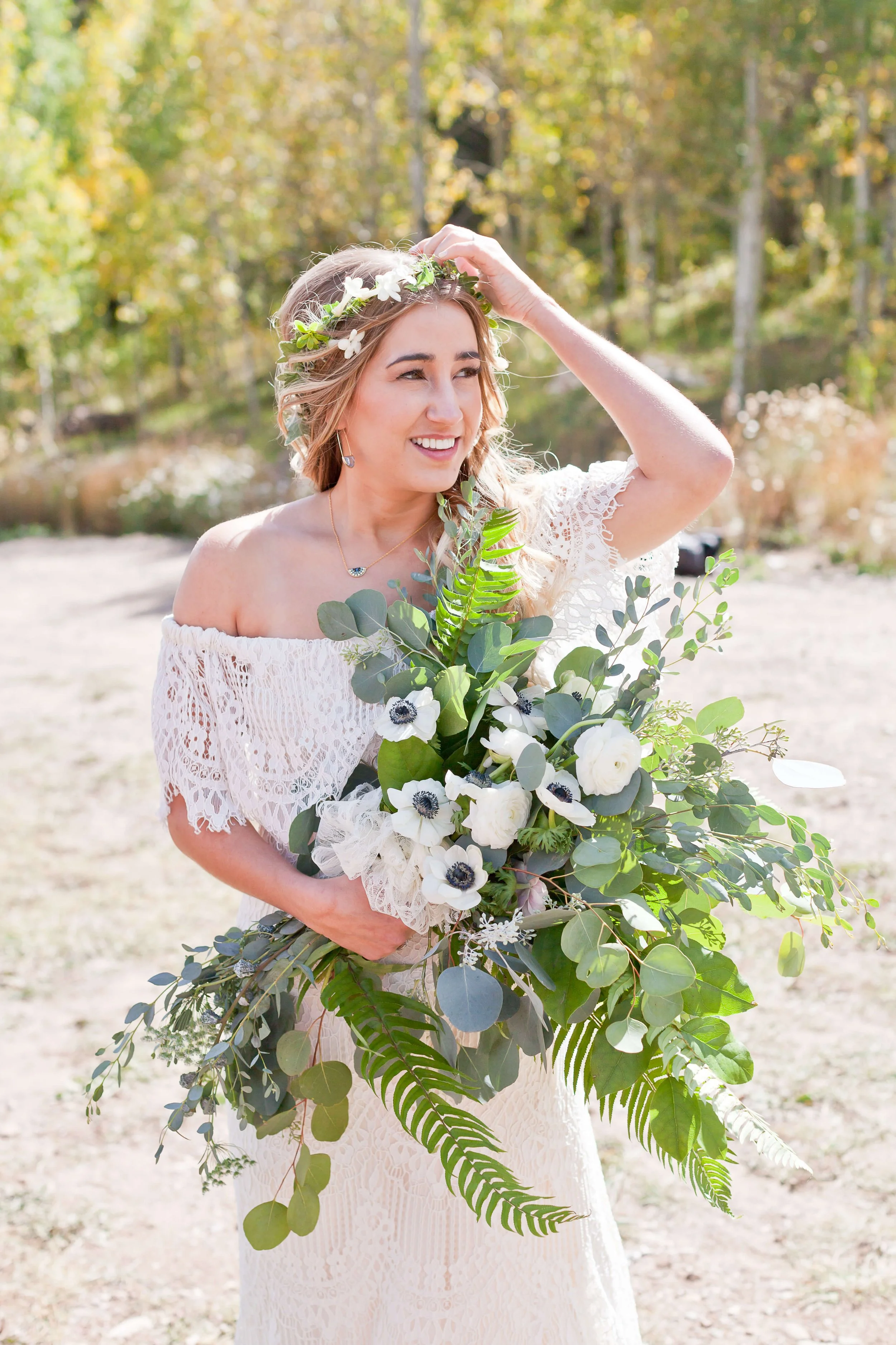 Large boho bridal bouquet with fresh, bright whites, and trailing greenery captured by Ginger Moose Photography.