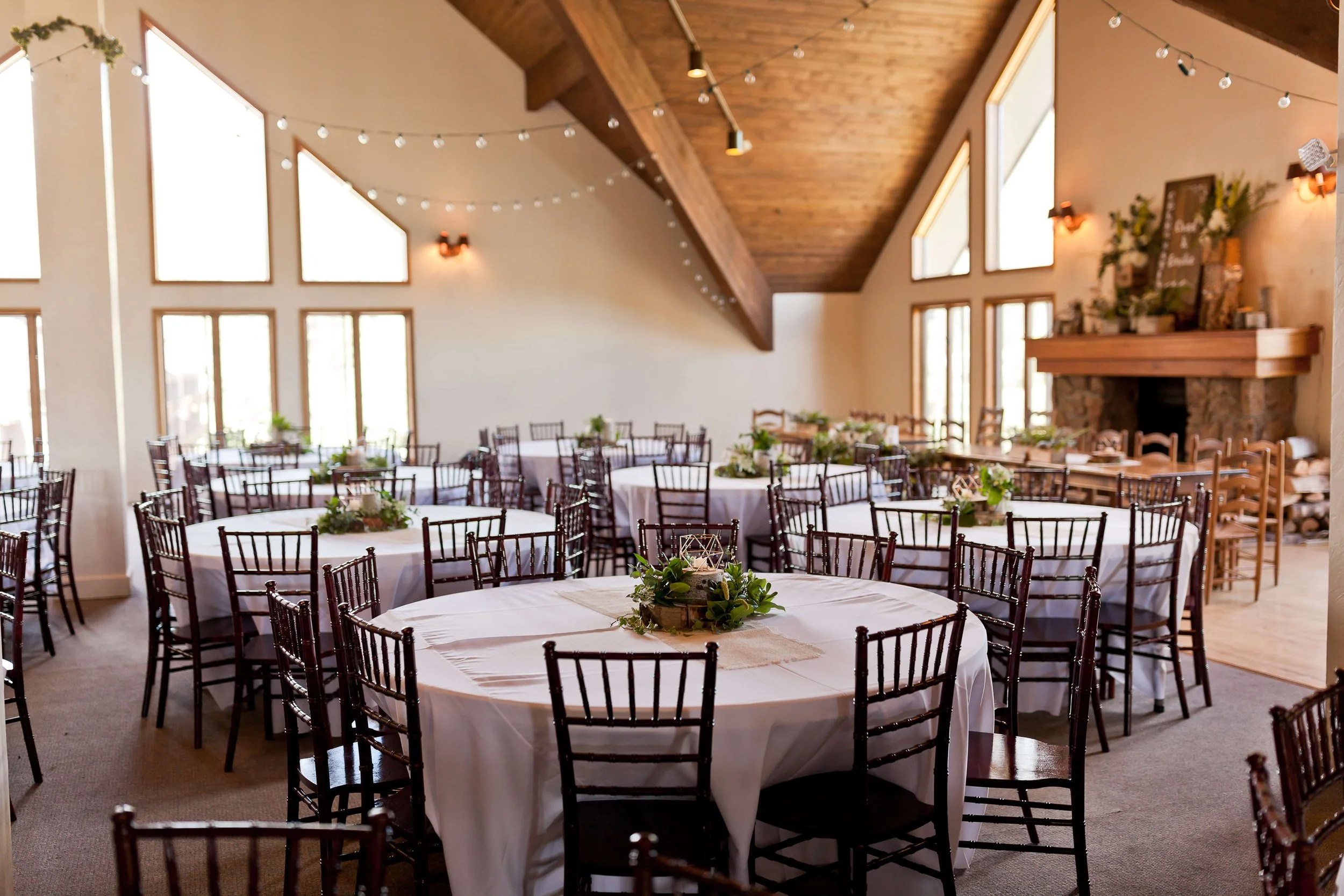 Reception table with boho inspired decor and locally sourced favors styled inside The Benchmark event hall in Durango.