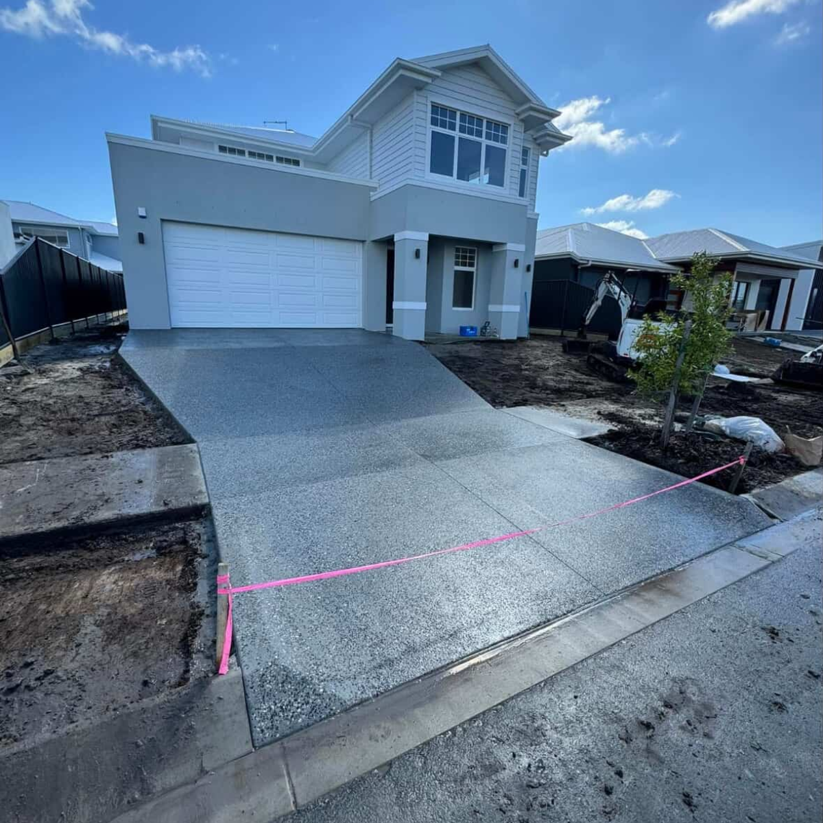 New Residential Concrete Driveway Installed By Bulty’s Concreting On The Sunshine Coast, Featuring A Clean, High-End Finish For A Modern Home, Part Of Our Driveway Concreting And Residential Concrete Services.