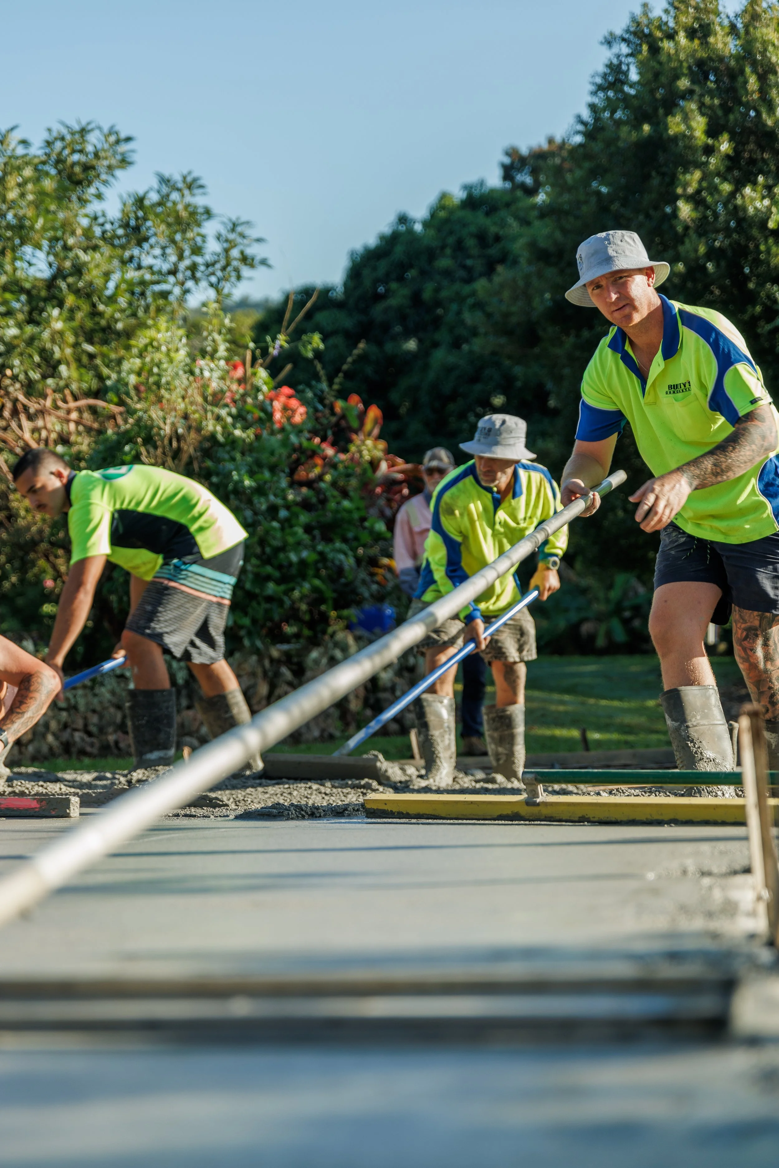 Bulty’s Concreting Team Smoothing Fresh Concrete Slab On The Sunshine Coast