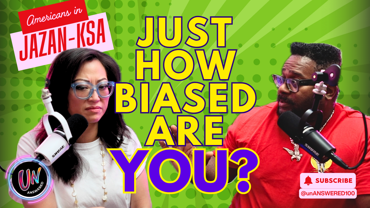 Two people, a woman and a man, speaking into microphones during a podcast or radio recording, with a vibrant green background and bold yellow and purple text that asks, "Just how biased are you?"