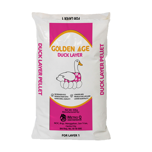 White bag of Golden Age Duck Layer Pellets with a pink label, featuring an illustration of a duck with a floral pattern on its body, and text indicating it's for layer 1 poultry, manufactured by Metro Q in Nigeria.