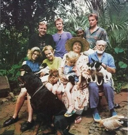 Archive photograph of a group of nine people, children and adults.