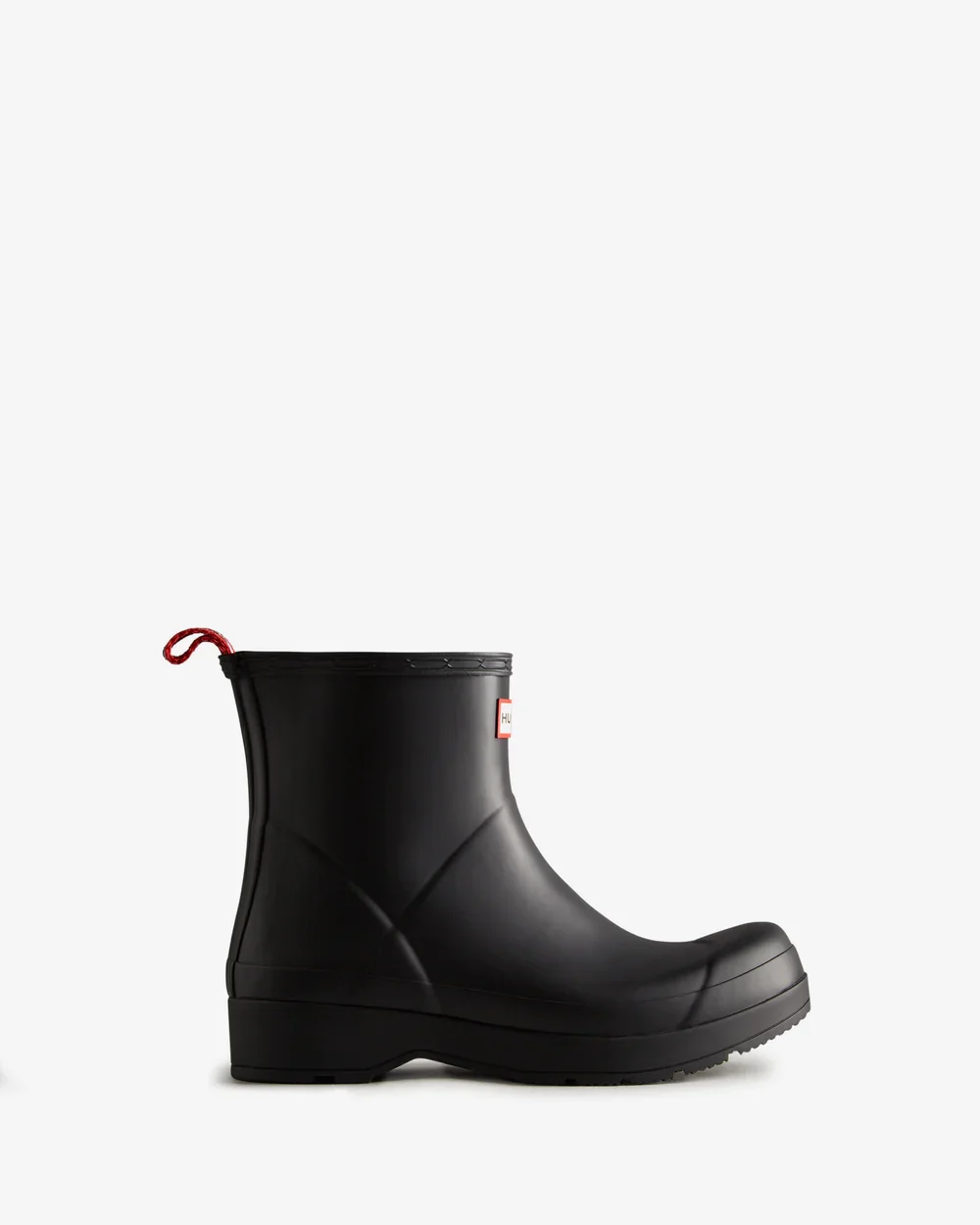 A single black rain boot with a red pull loop on the back, set against a plain white background.