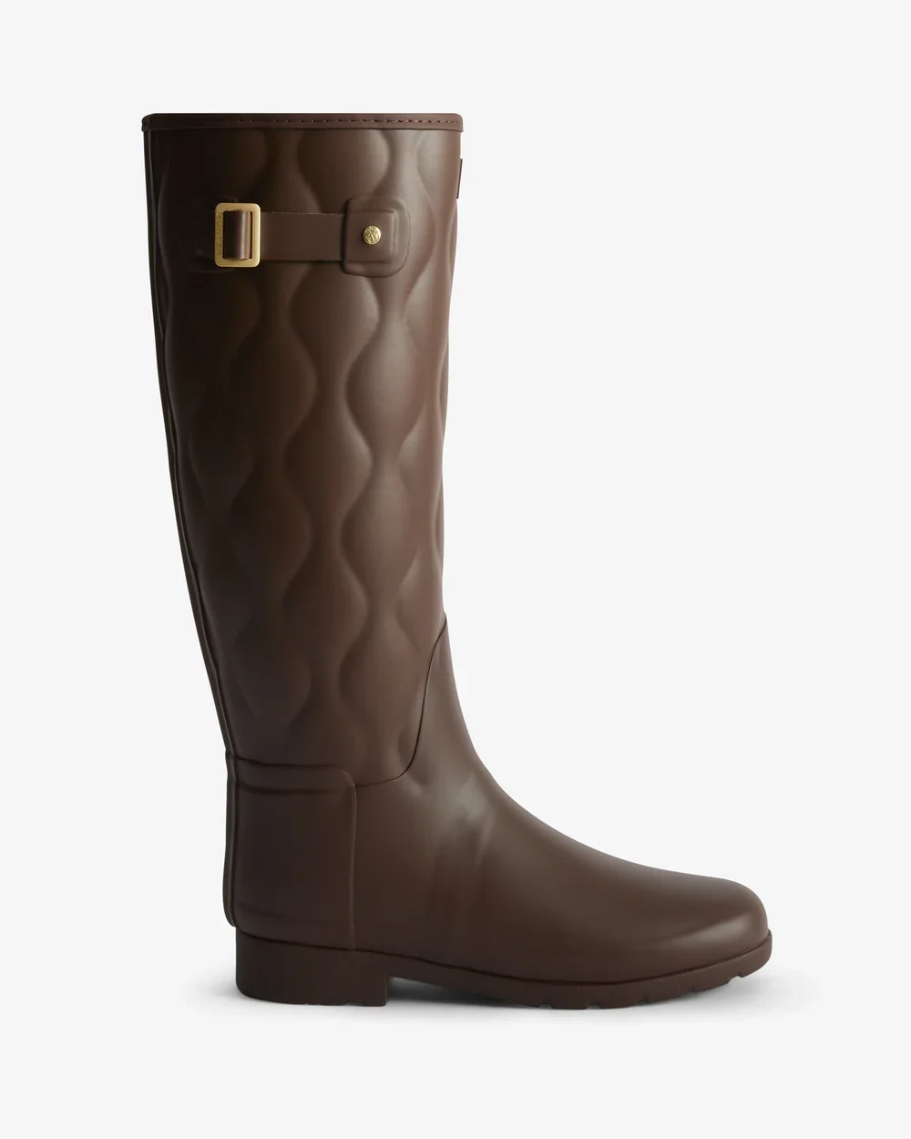 A tall, brown, quilted rain boot with decorative buckle detail and a flat heel.