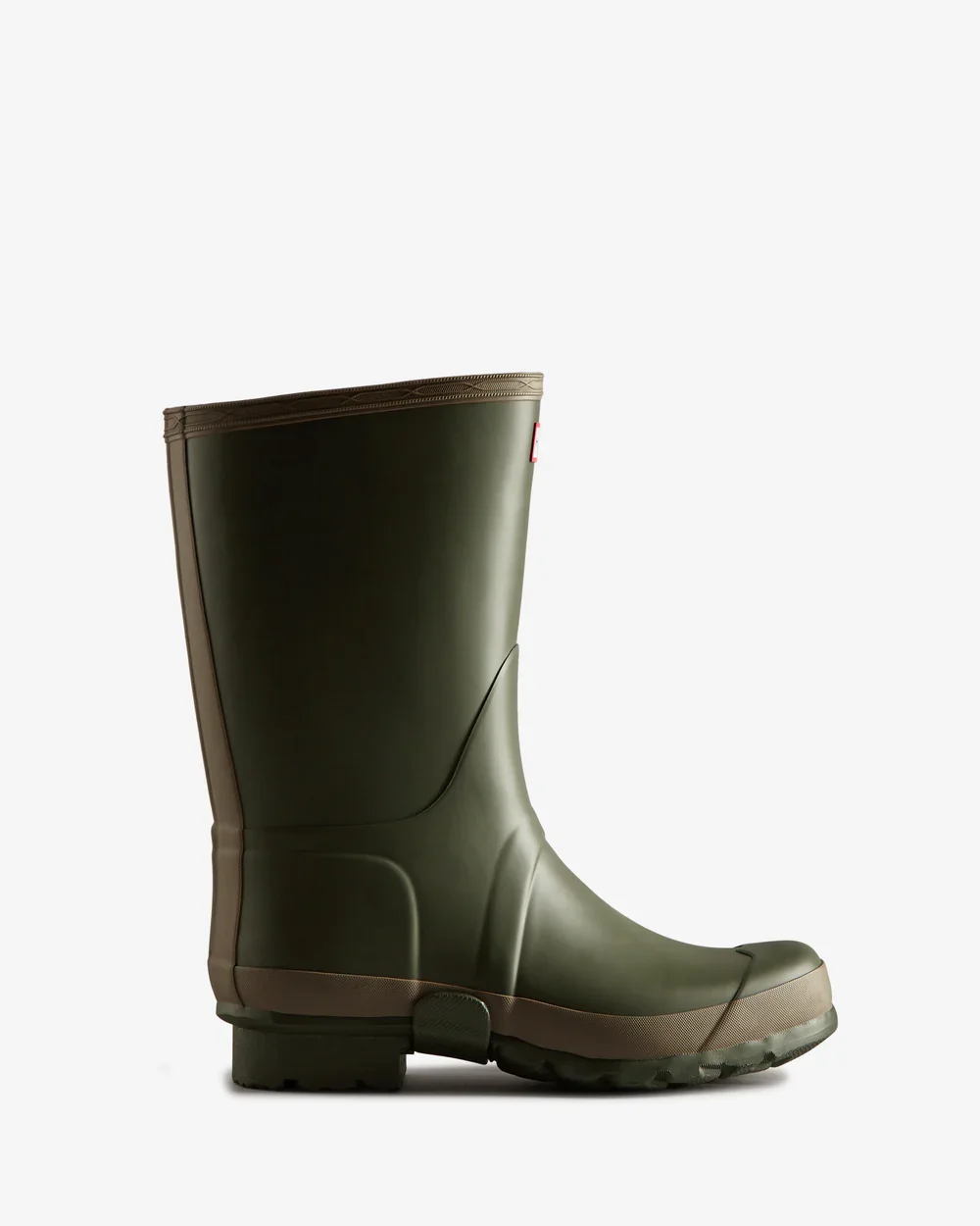 A green rubber rain boot with a beige sole against a plain white background.