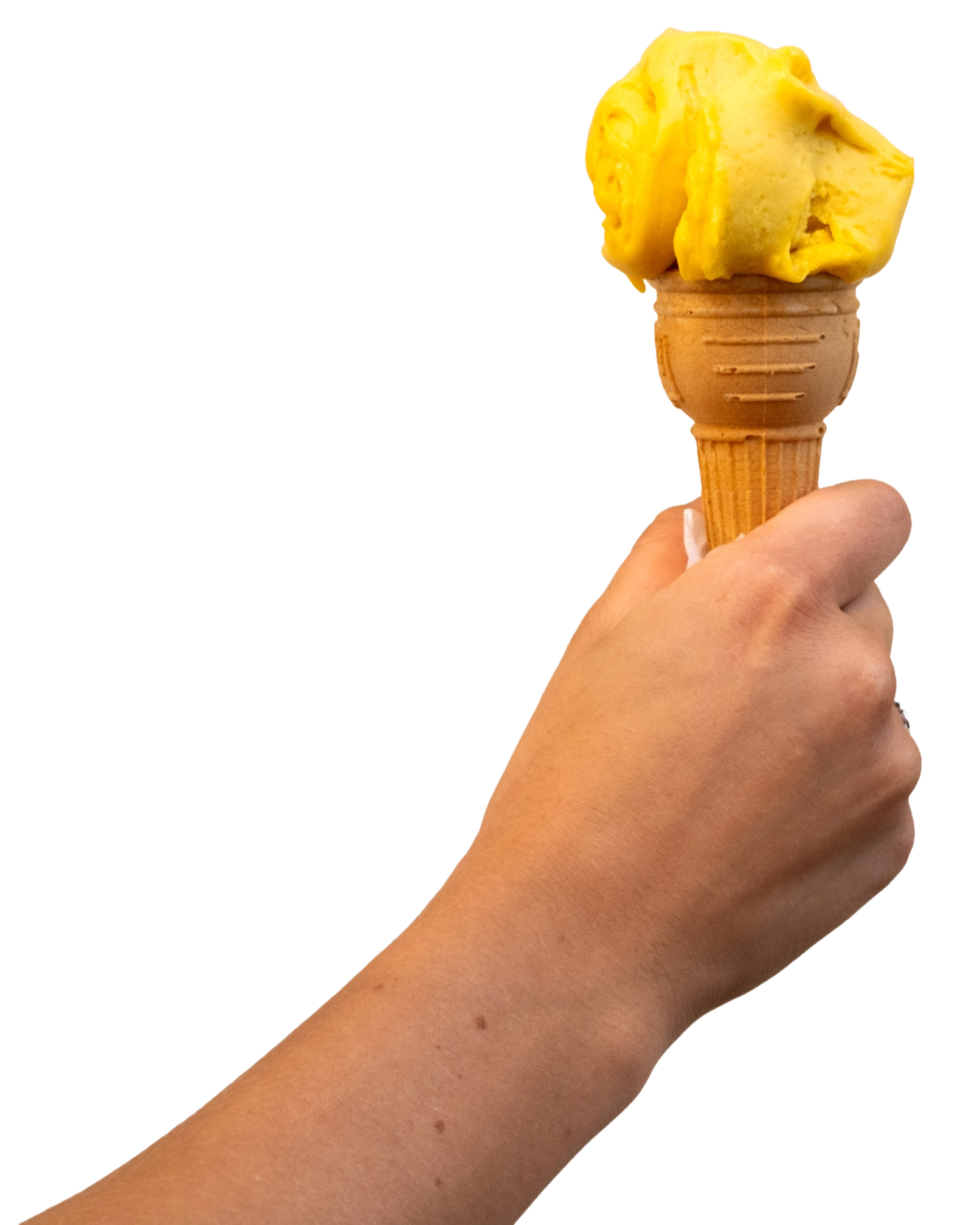 A hand holding an ice cream cone with yellow ice cream on top.