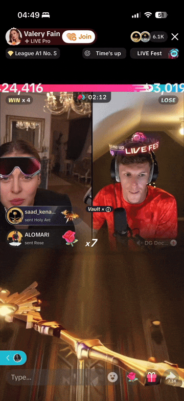 A split-screen view of two people during a live streaming game. The left side shows a woman wearing glasses with tinted lenses, in a room with ornate decor and a chandelier, while the right side shows a man wearing headphones with a microphone, in a decorated room. There are animated game elements and viewer comments overlayed on both sides.