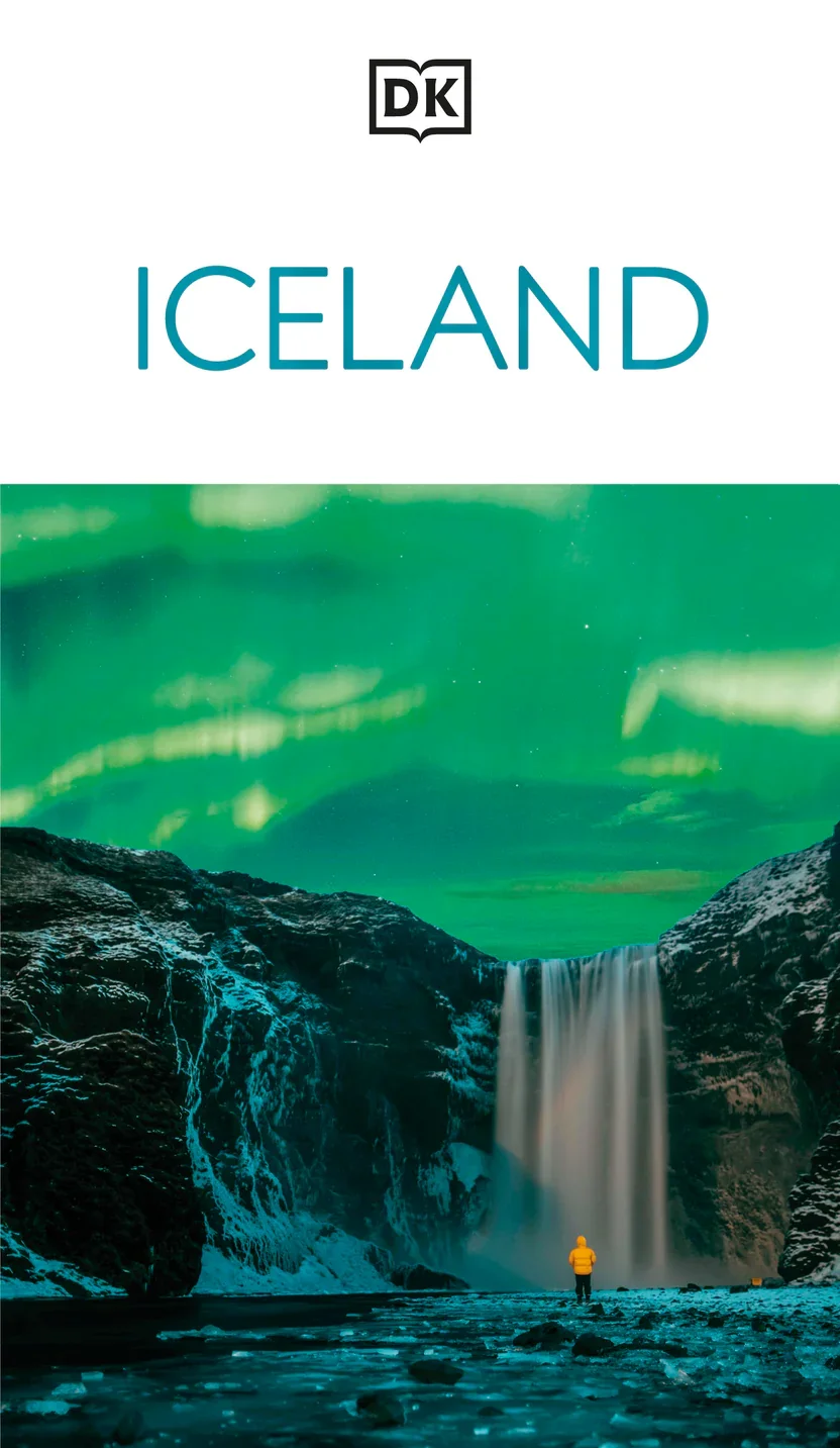 Cover of a travel guidebook titled "Iceland," featuring a person in a yellow jacket standing near a waterfall under a green northern lights sky.