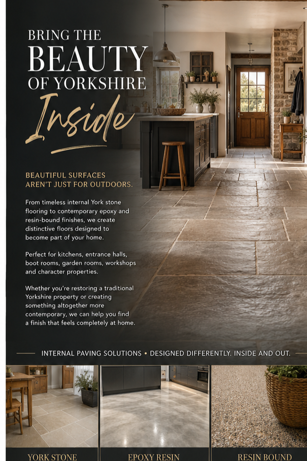 An interior space with York stone flooring in a kitchen and entryway, featuring a kitchen island, wooden stool, natural light, and decorative plants, promoting Yorkshire stone flooring and esthetic options.
