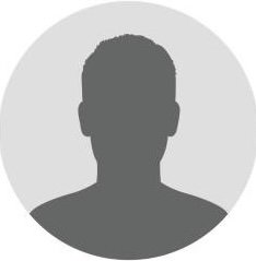 Ein unscharfes Silhouettenbild eines Mannes vor grauem Hintergrund.