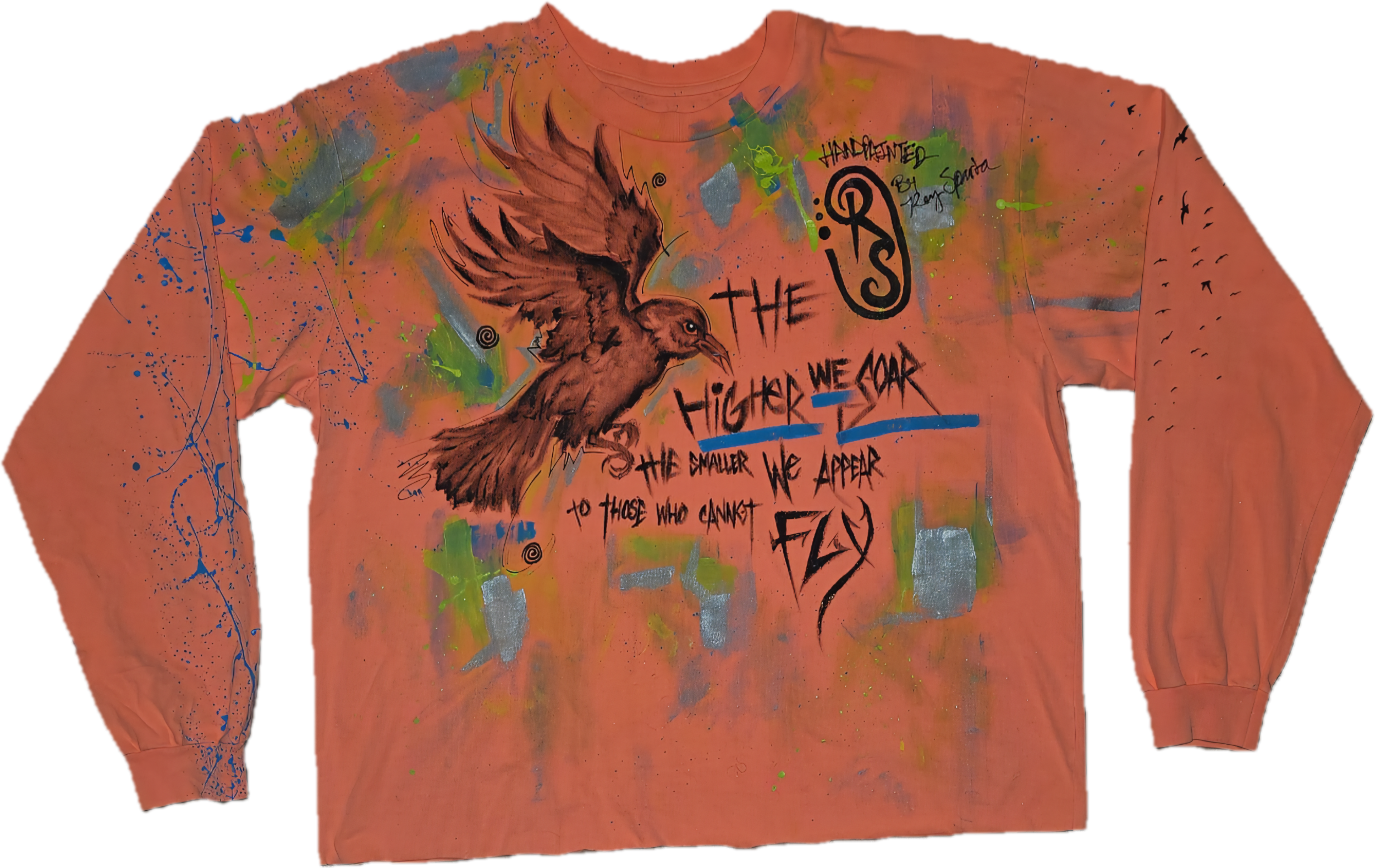 A colorful, artistically painted sweatshirt with a large crow, graffiti-style text, and various splatters of paint. The text includes attributed handwriting, slogans like 'The Higher We Soar, The Smaller We Appear,' and other artistic elements.