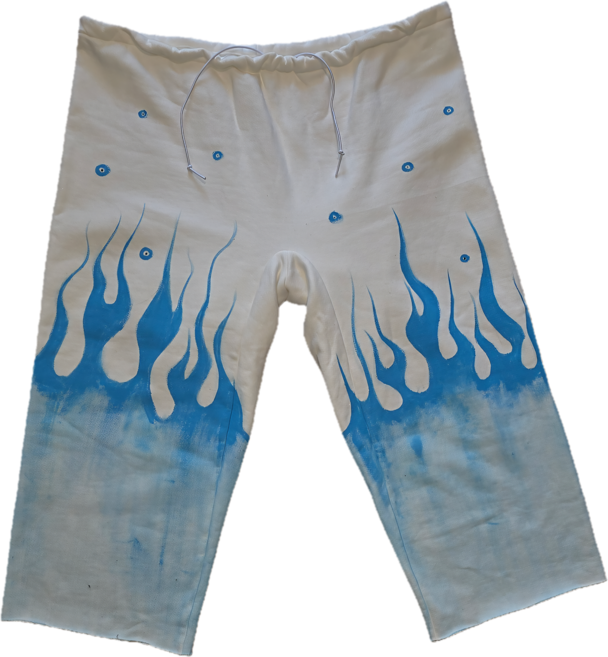 White pants with blue flame design and eye decorations.
