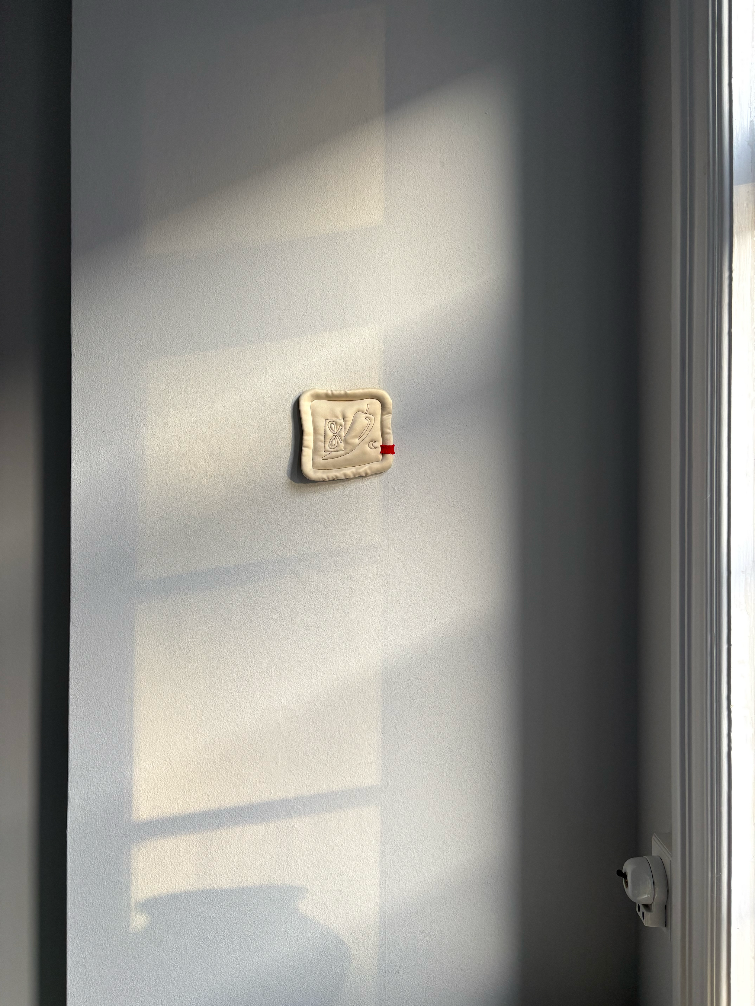 Small satin textile relief artwork