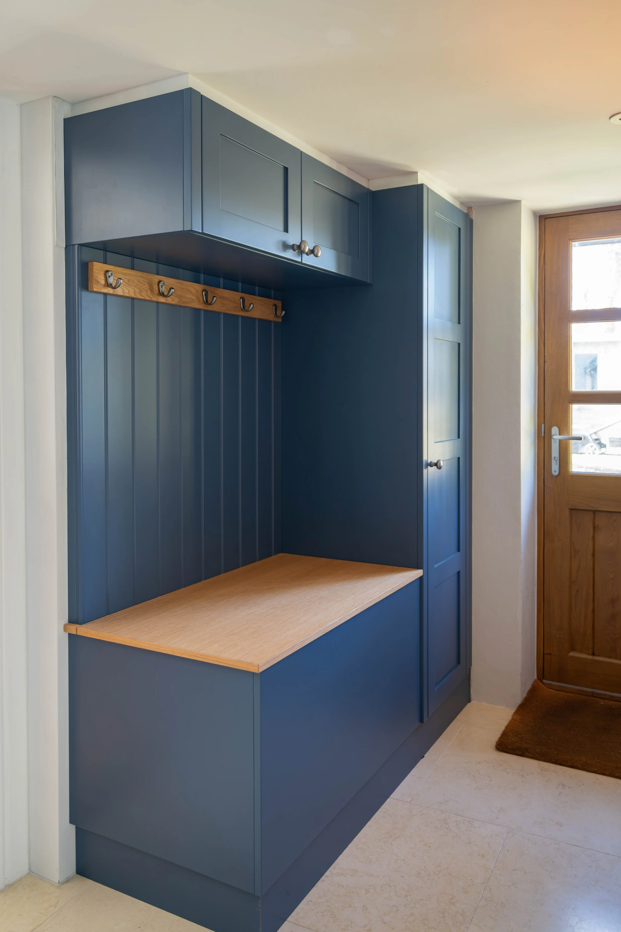 painted boot room with blanket box and hanging rail in oak
