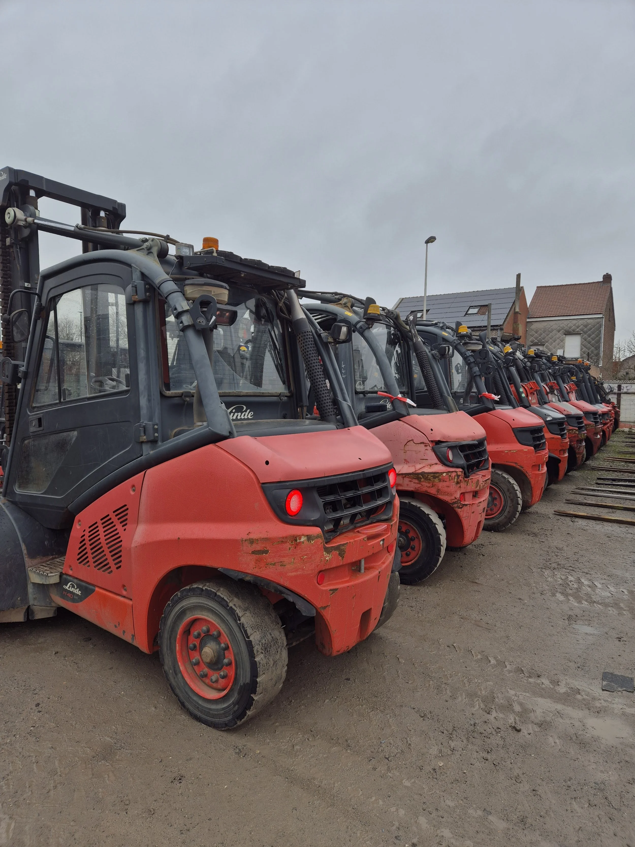 Used Linde diesel forklifts lined up for wholesale export at VIMEX in Comines, Belgium