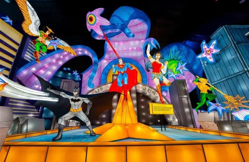 Colorful superhero and comic book stars on a bright display at a city scene