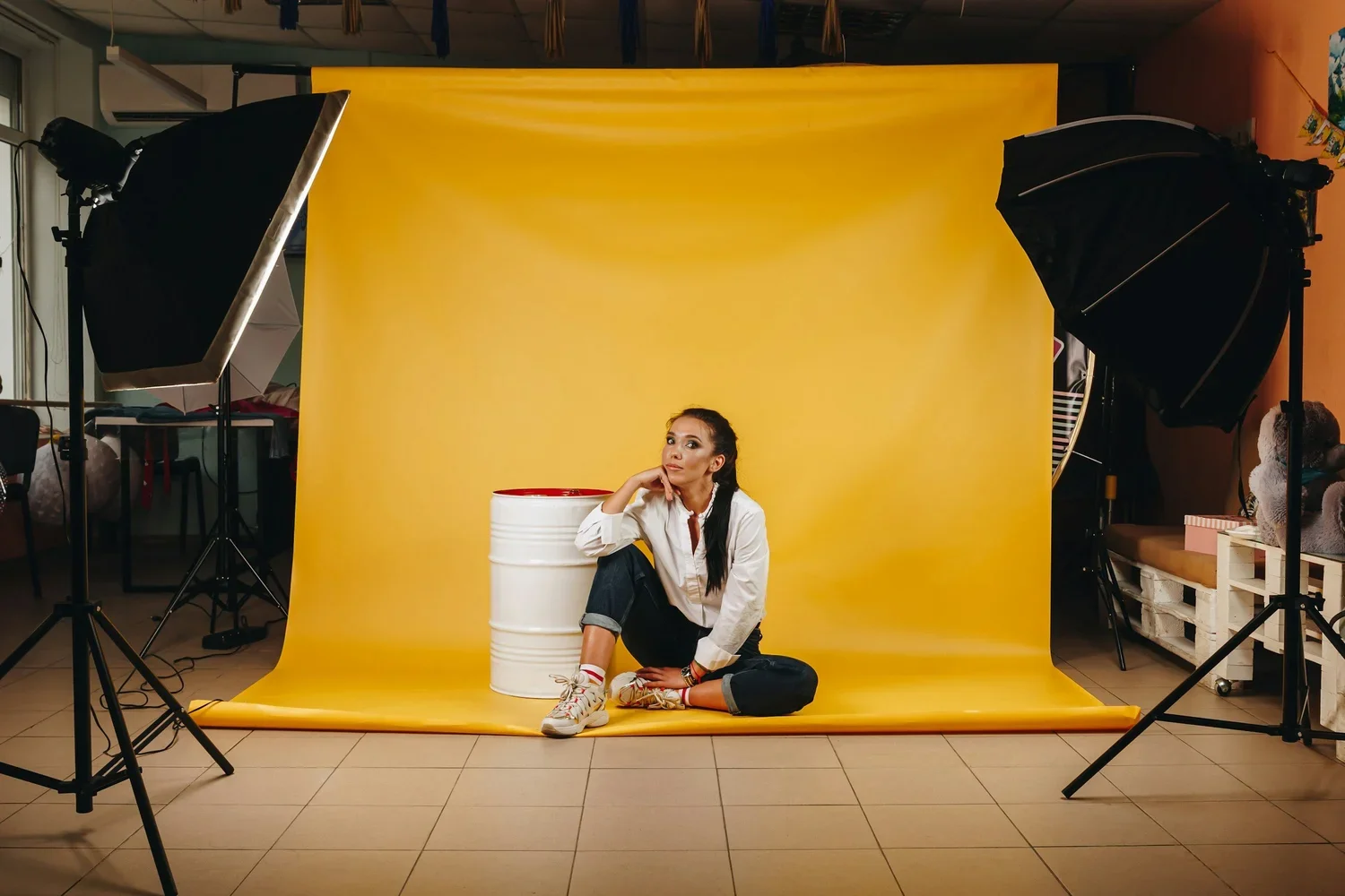 woman in front of a paint bucket