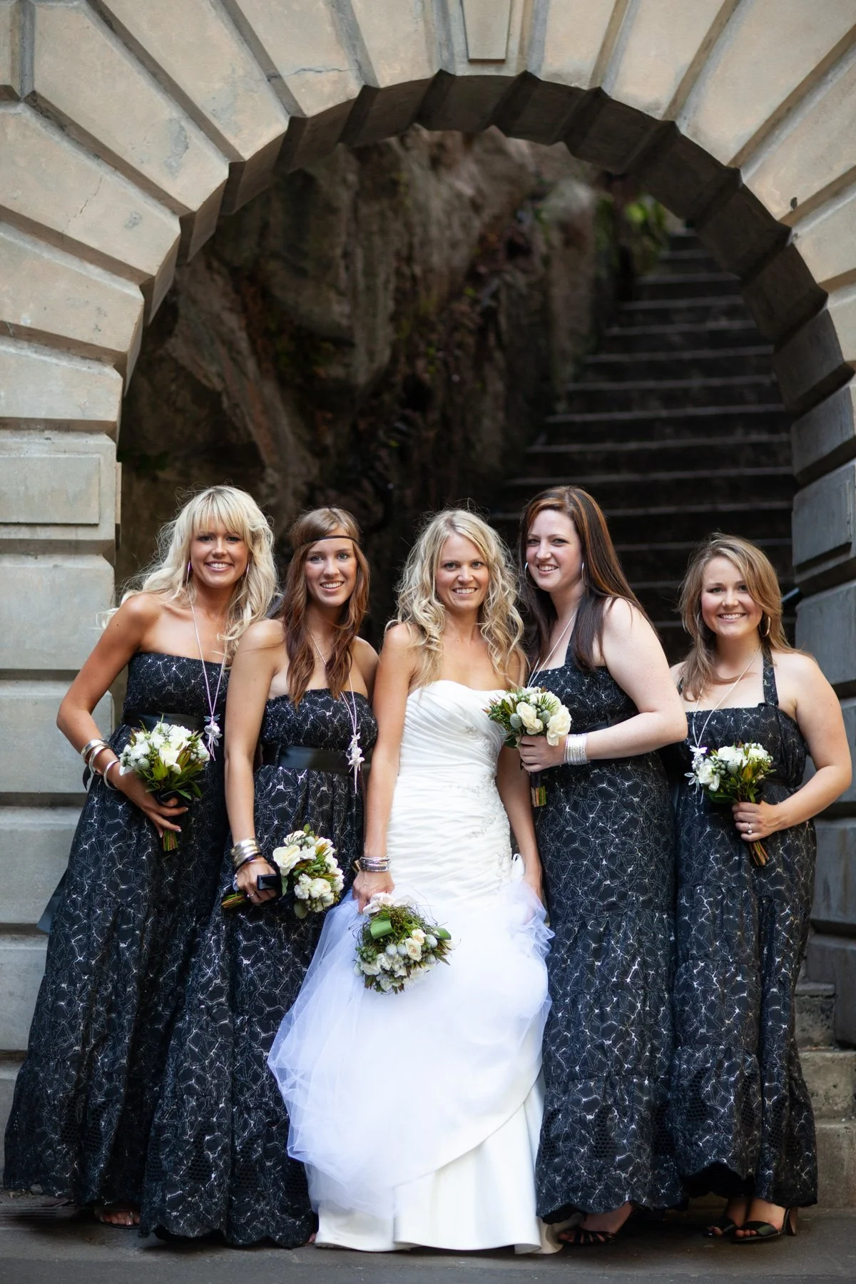 Bride with bridesmaids at Argyle Cut arch The Rocks Sydney