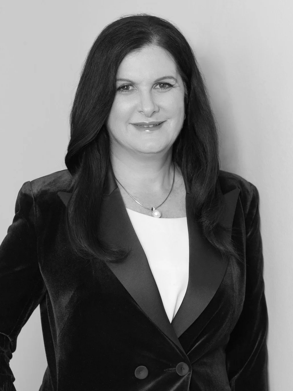 Dominique relaxed standing black and white corporate portrait