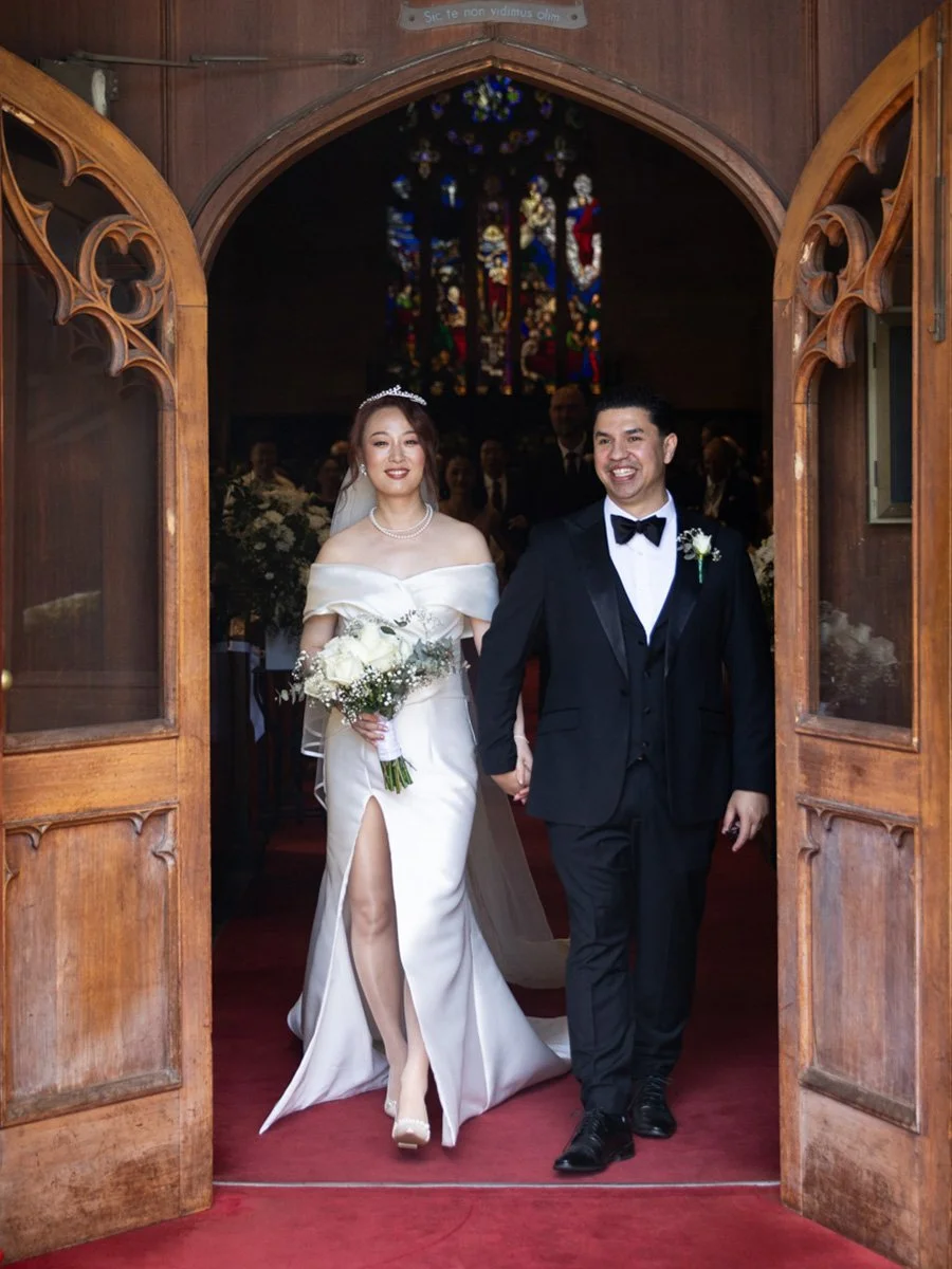 Couple exit through wooden doors, Garrison Church, Millers Point
