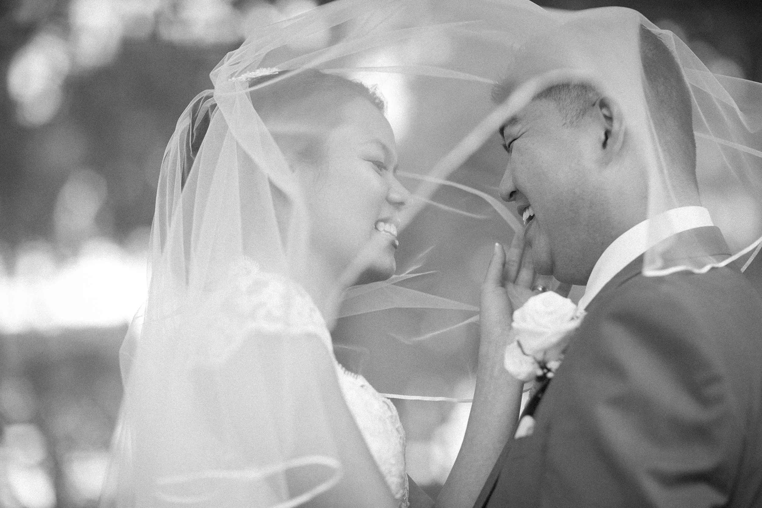 Bride and groom under veil Centennial Park Sydney wedding portrait black and white