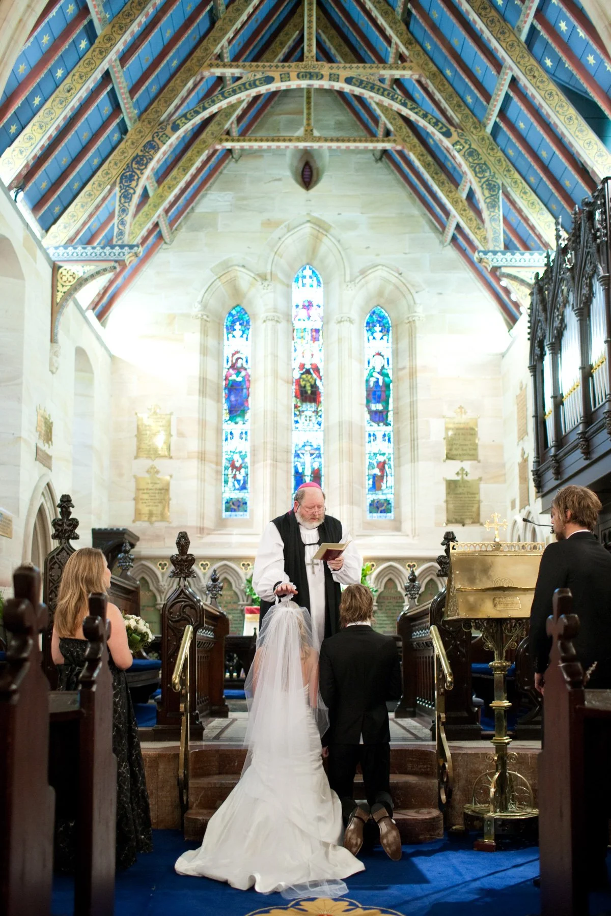 Priest blessing couple at St Marks Anglican Church Darling Point