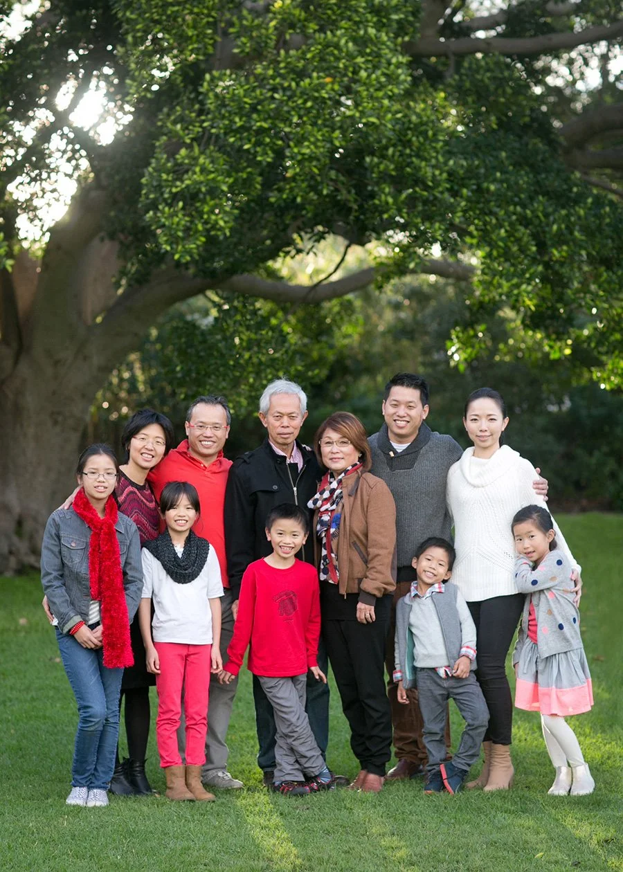 Extended family group under tree in Botanic Gardens