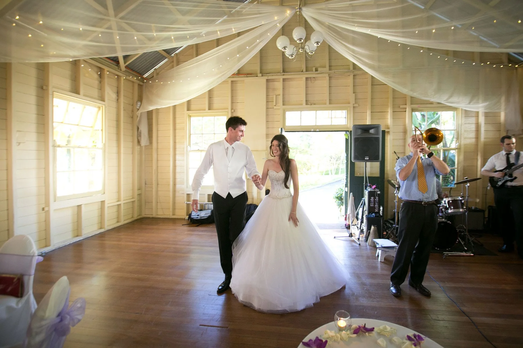 Bride and groom entering wedding reception at Athol Hall, Mosman