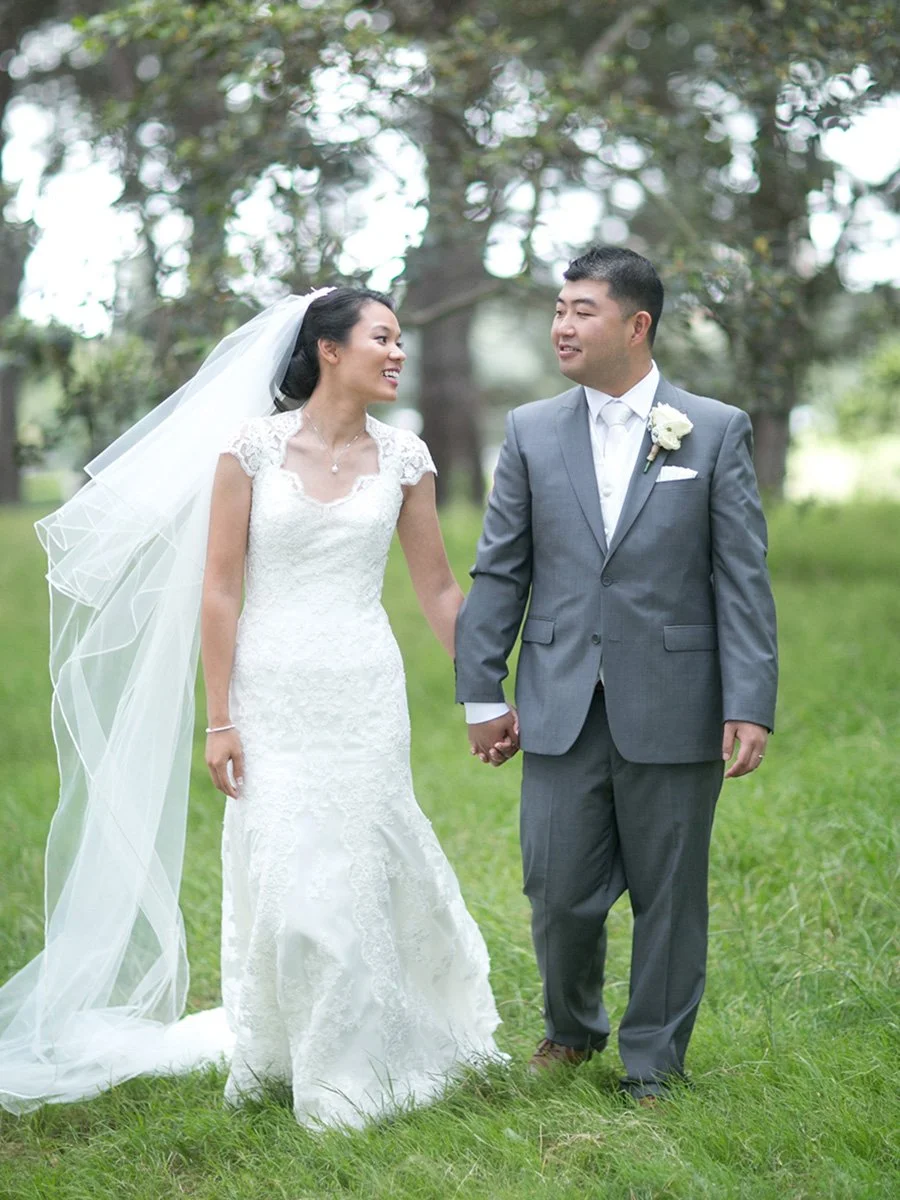 Bride and groom walking together Centennial Park pine forest Sydney wedding portrait