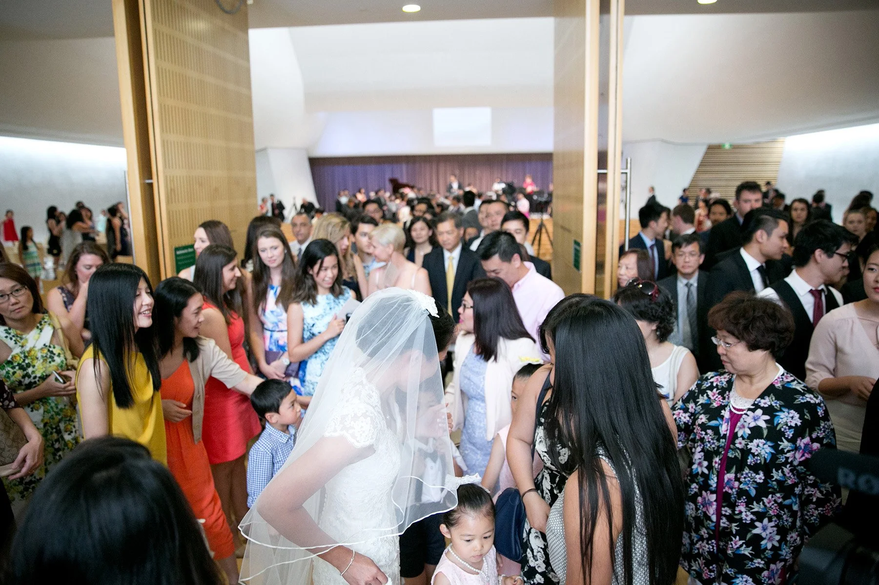 Bride mingling with friends after ceremony St Barnabas Broadway Ultimo Sydney black and white