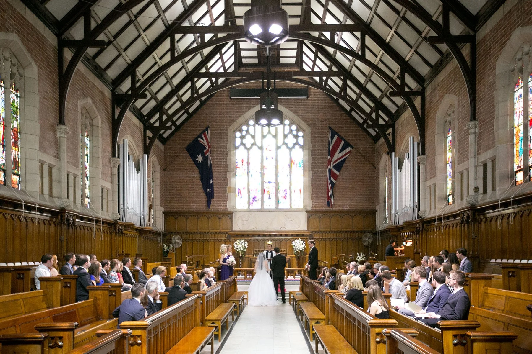 Wide wedding ceremony shot inside Shore School Chapel, North Sydney
