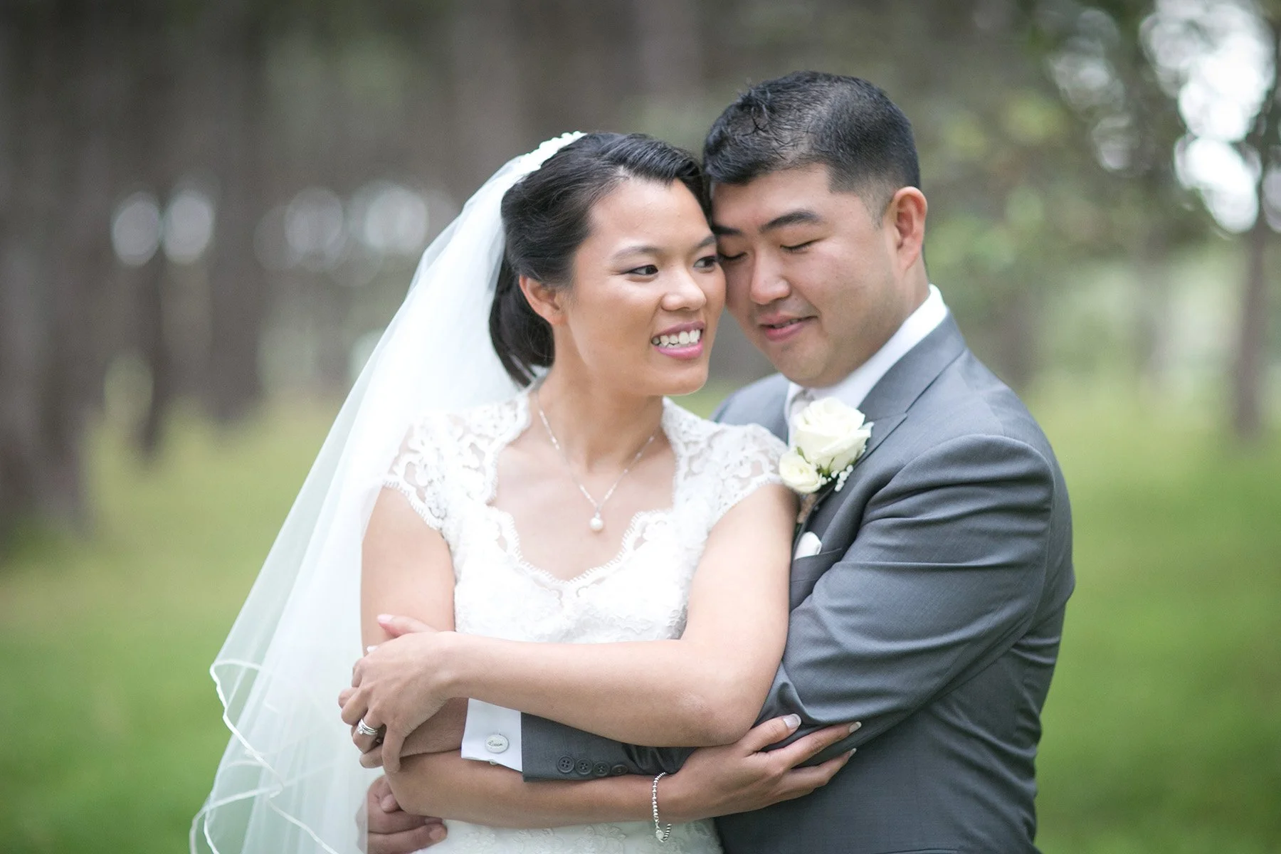 Groom gentle embrace of Bride Centennial Park Sydney