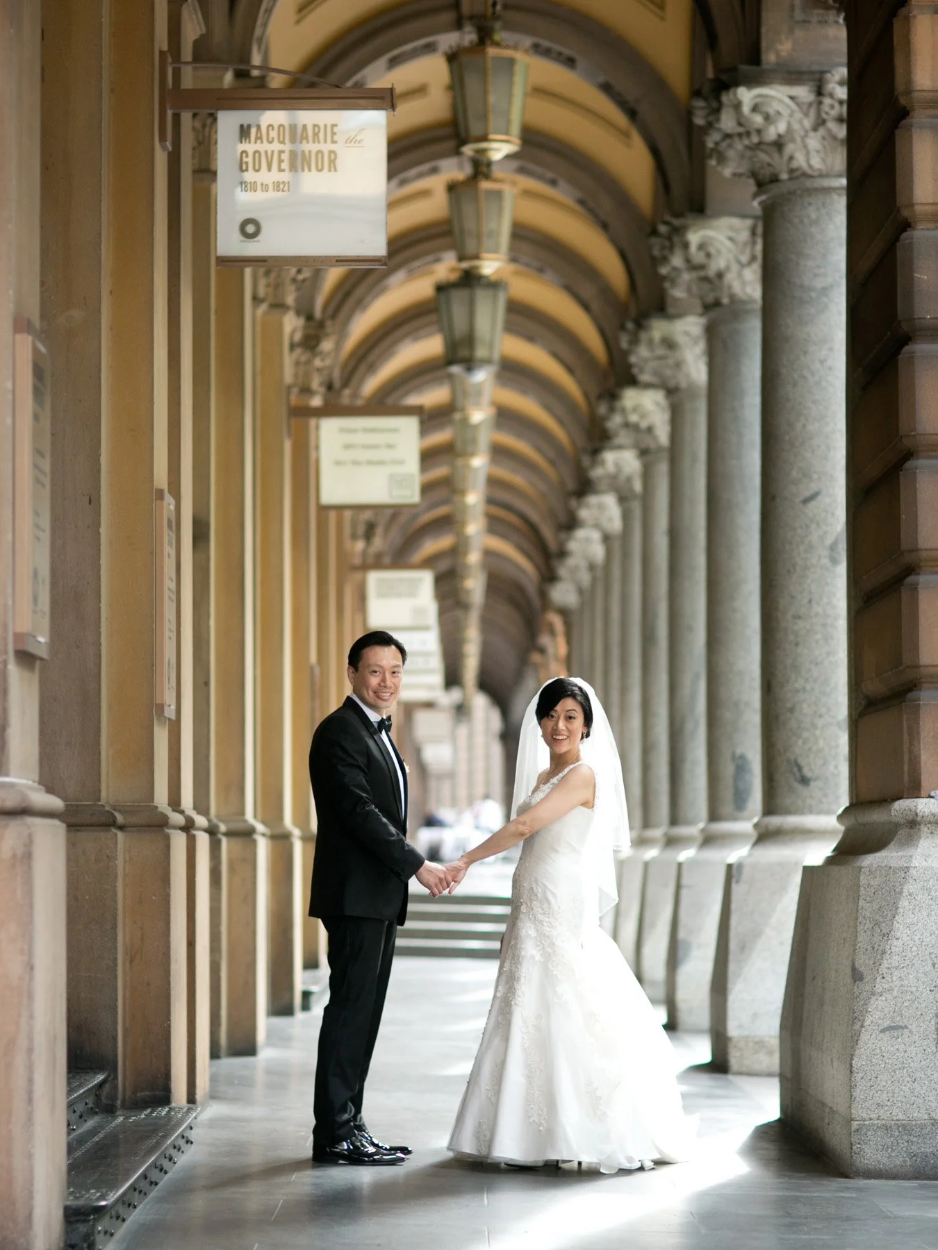 Bride and groom portrait in GPO colonnade, Martin Place Sydney