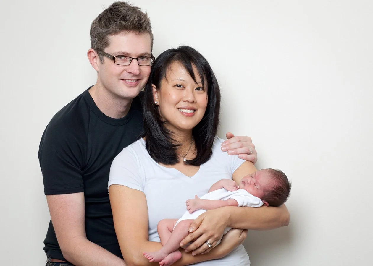 Couple holding newborn baby 