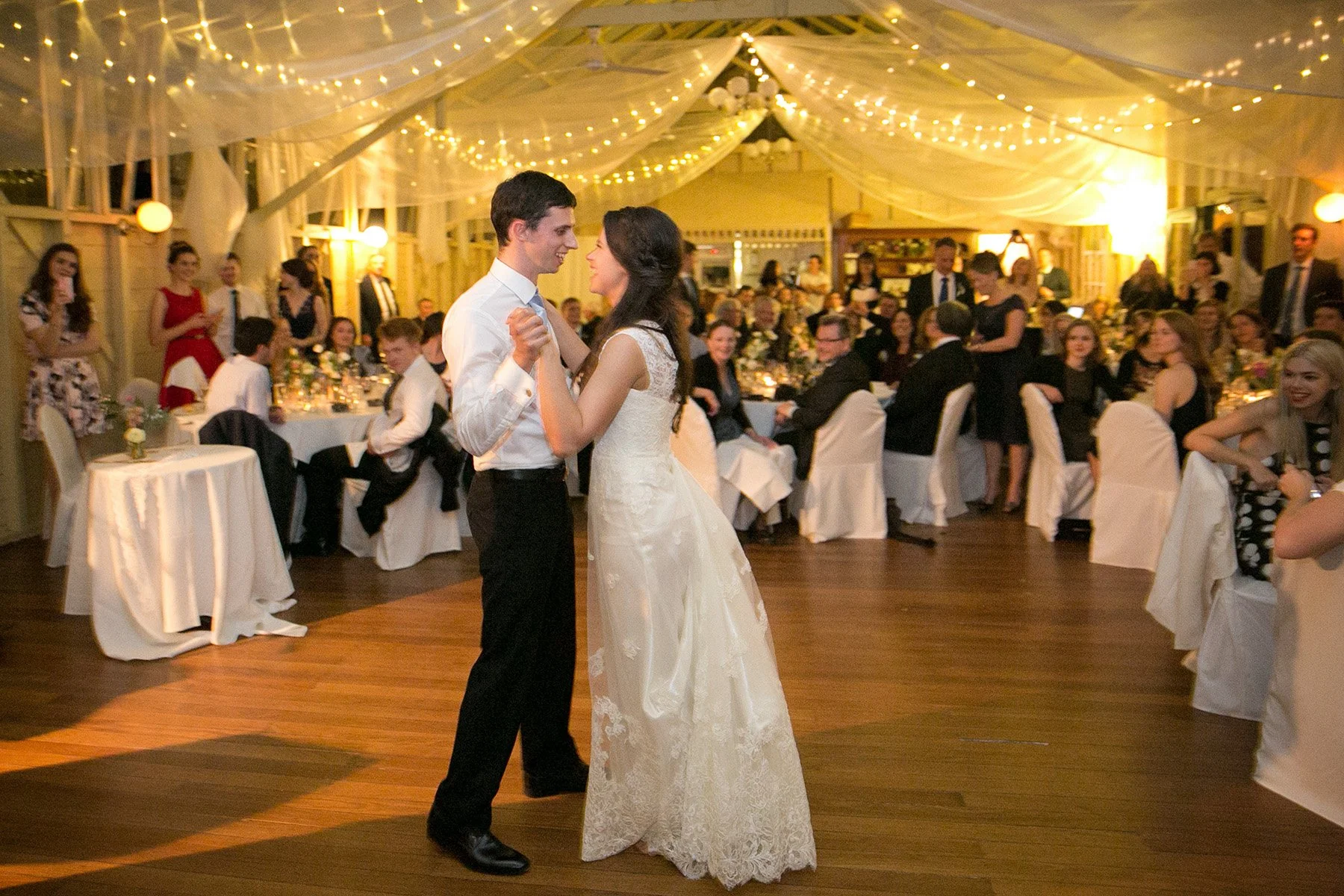 Bride and groom sharing their first dance surrounded by guests, Athol Hall Mosman