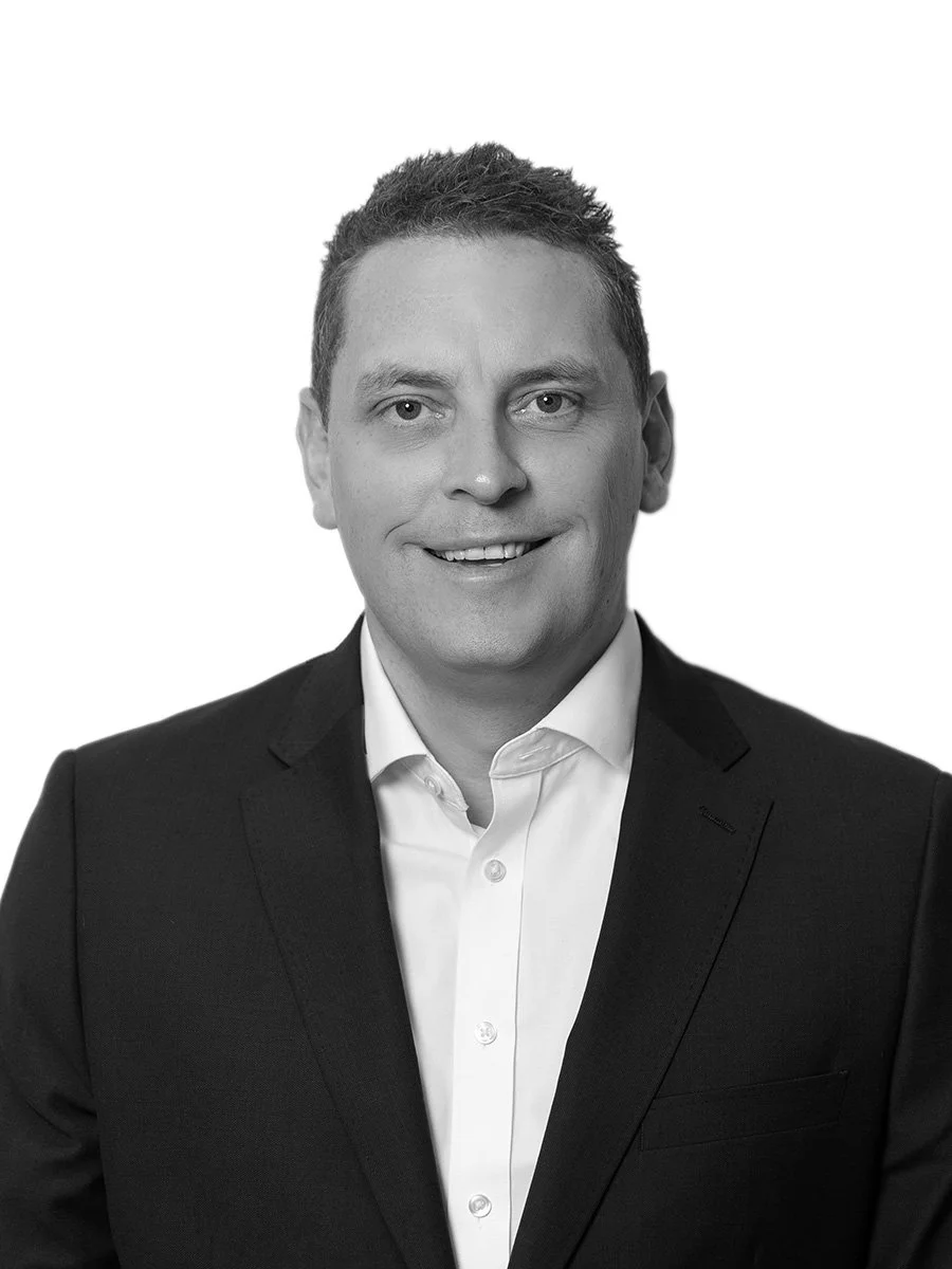 Chris corporate headshot in city office